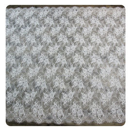 花嫁の服のレースの生地を染めるナイロン アイボリーの花のスカラップで仕上げられた研がれた常態 サプライヤー