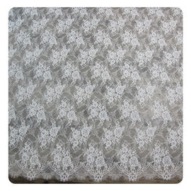 花嫁の服のレースの生地を染めるナイロン アイボリーの花のスカラップで仕上げられた研がれた常態 サプライヤー